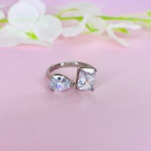 Emerald and Pear Cut Diamond Ring